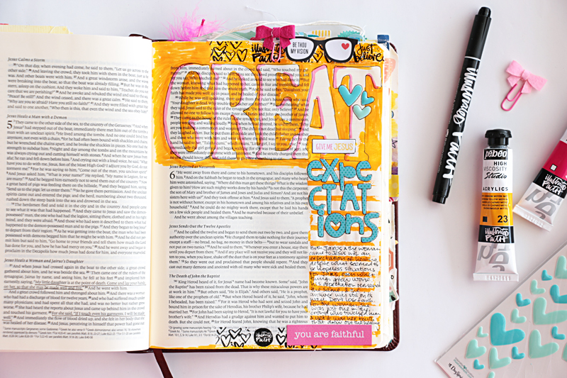 Natalie shares a process video showing some fun techniques such as how to get a giant title into your journaling bible, as well as a masking and painting tip to create colourful journaling lines