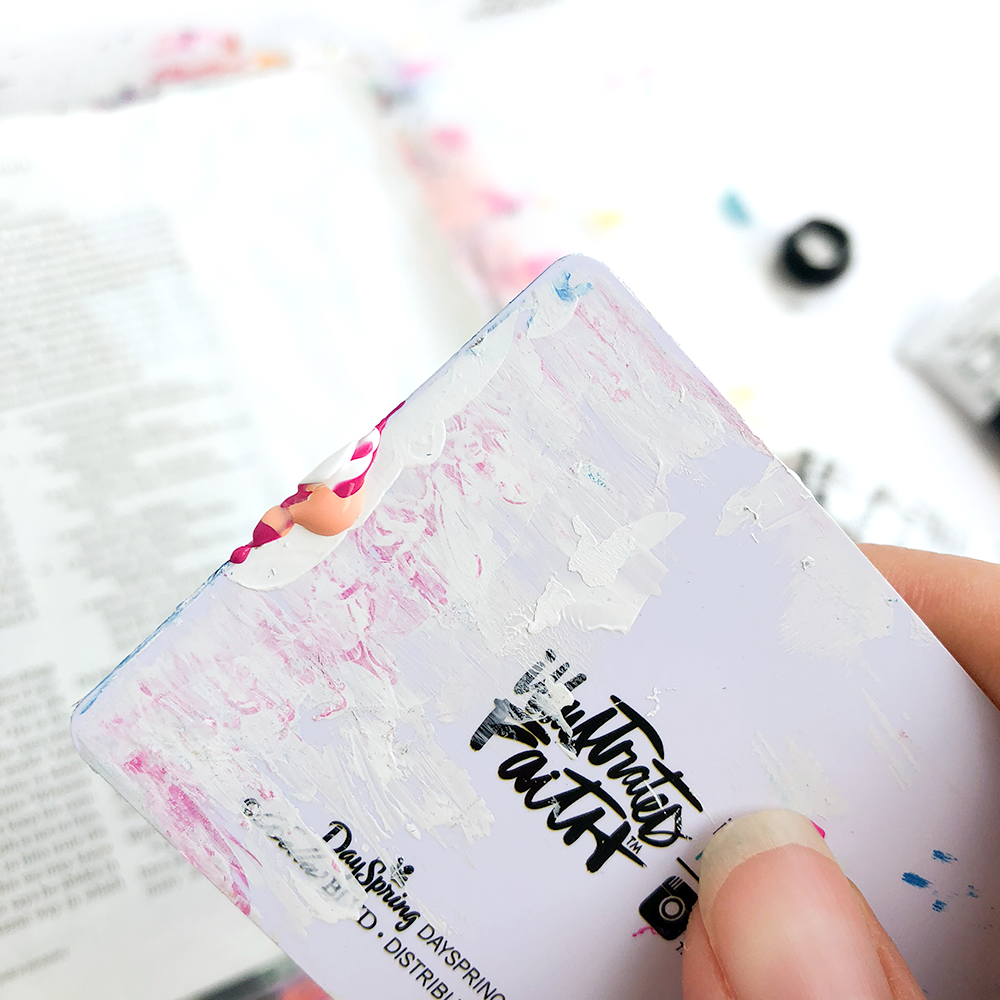 mixed media Bible journaling tutorial by Heather Greenwood | scraping paint in curved shapes to create flowers