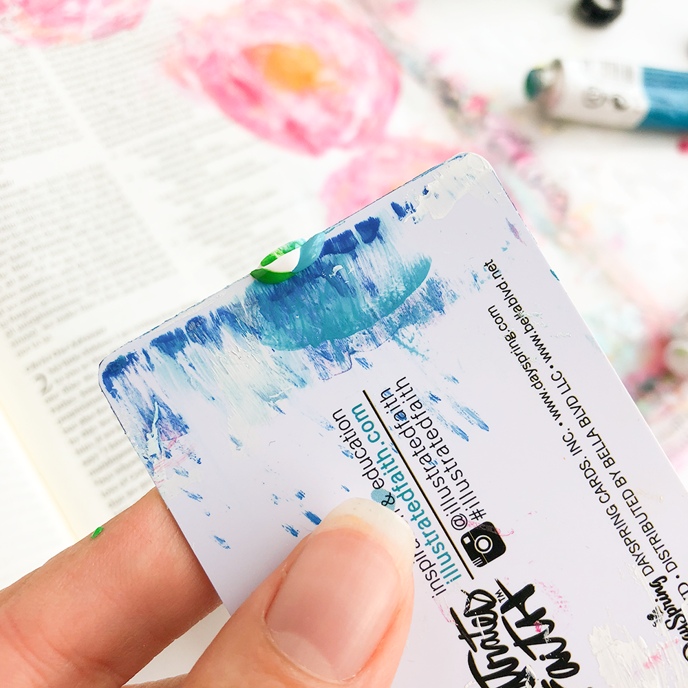 mixed media Bible journaling tutorial by Heather Greenwood | scraping paint in curved shapes to create flowers